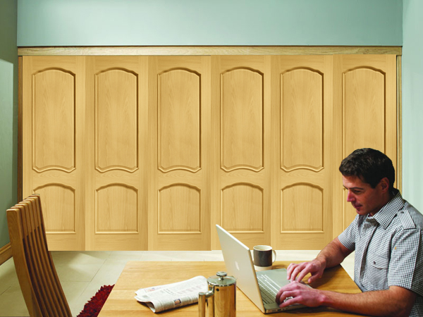 Freefold Louis (with raised mouldings) Oak Internal Folding Sliding Doors